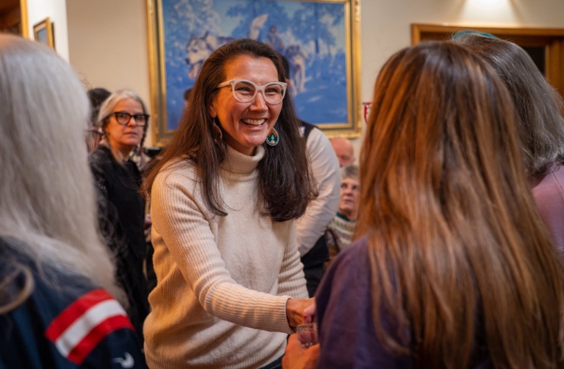 Mary Pelota greets voters.