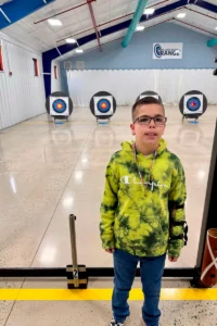 Dylan Webb, a young boy in glasses.