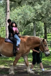 Mother and daughter on horseback