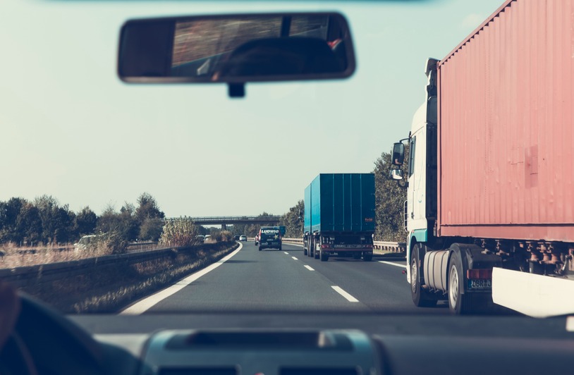 What a Trucking Company’s Safety Record Leaves Out A large semi truck driving on a highway under a clear sky