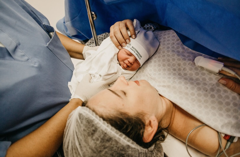 What Is Vaginal Seeding? Newborn baby resting on a blanket