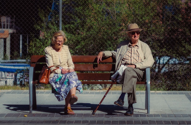 Adult Pull-Up Diapers Explained and What You Should Know Before Using Them Elderly couple relaxing on a bench outdoors