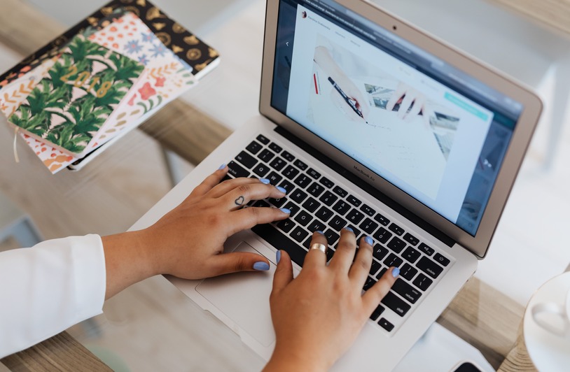 Best Cloud-Based PDF Tools to Merge Documents Without Installing Software in 2026 Person working on a laptop with document files open in a web browser