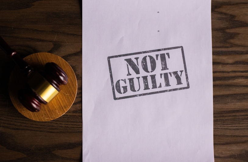 Terms You Will Commonly Hear in Criminal Cases A piece of paper saying NOT GUILTY