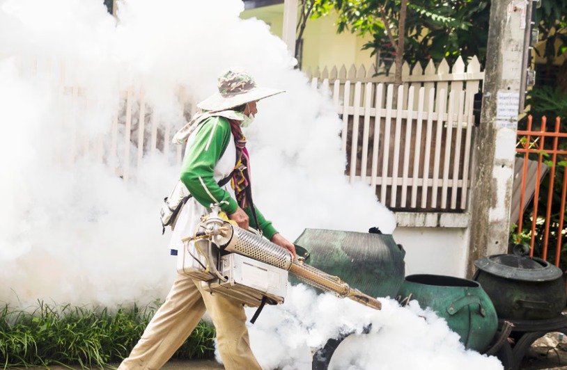 DCR-pest-control-simi-valley-Insert2 Technician using a thermal fogger for mosquito control
