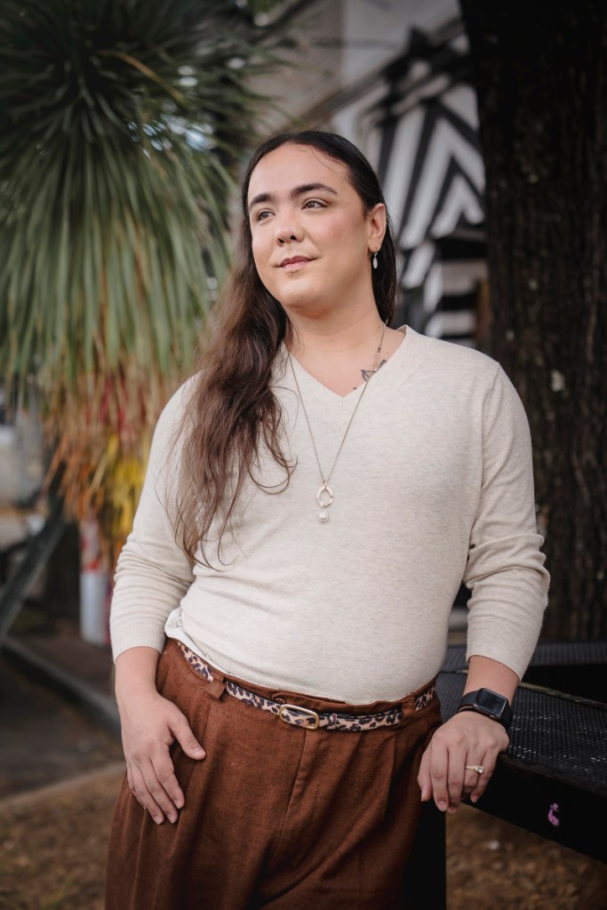 Portrait of Hudgins standing outside.