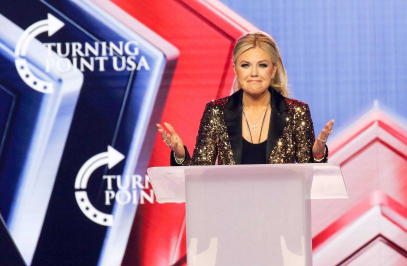 More Members and Money — And More Fractures: The Uncertain Future of Erika Kirk’s Turning Point USA Erika Kirk stands at podium during TPUSA rally.