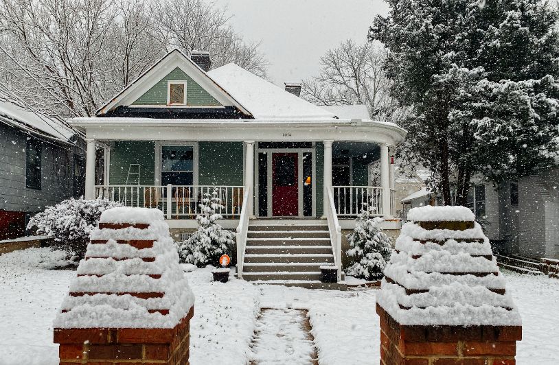 Next Hurdle: Home Heating Oil house in winter with snow